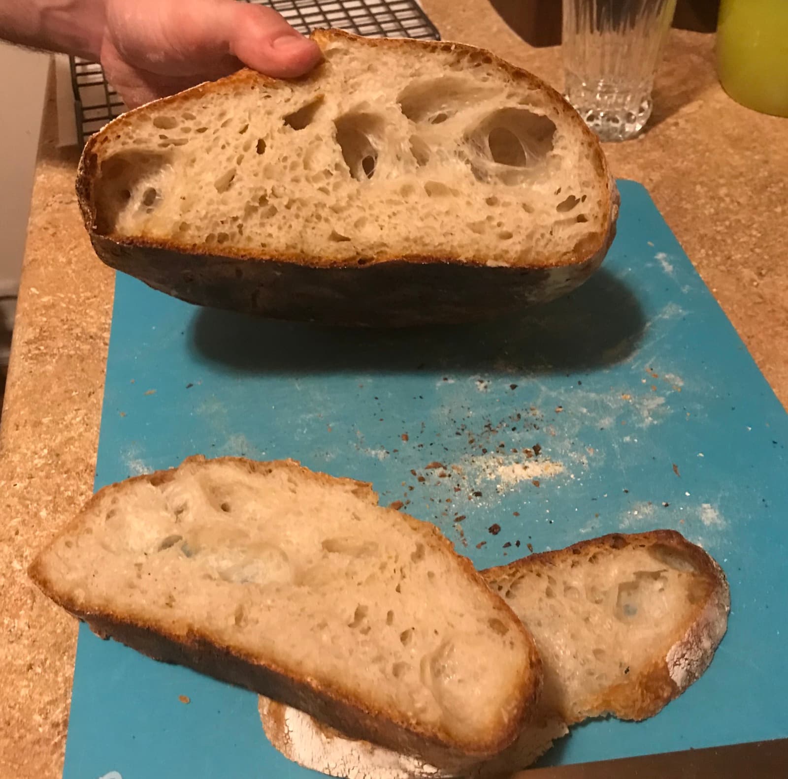 A sliced sourdough loaf showing the open crumb inside, from that first bake.